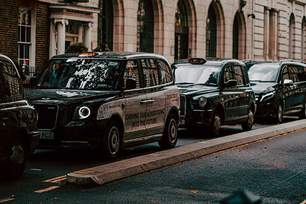 Taxi's waiting at the side of a road